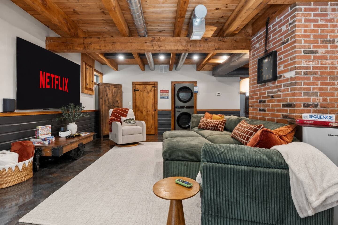 Open living area with exposed timber beams