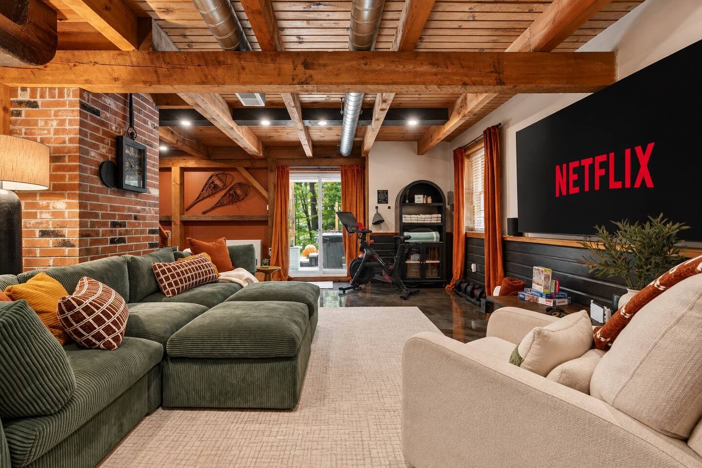 Living room with sectional sofa and big-screen smart TV